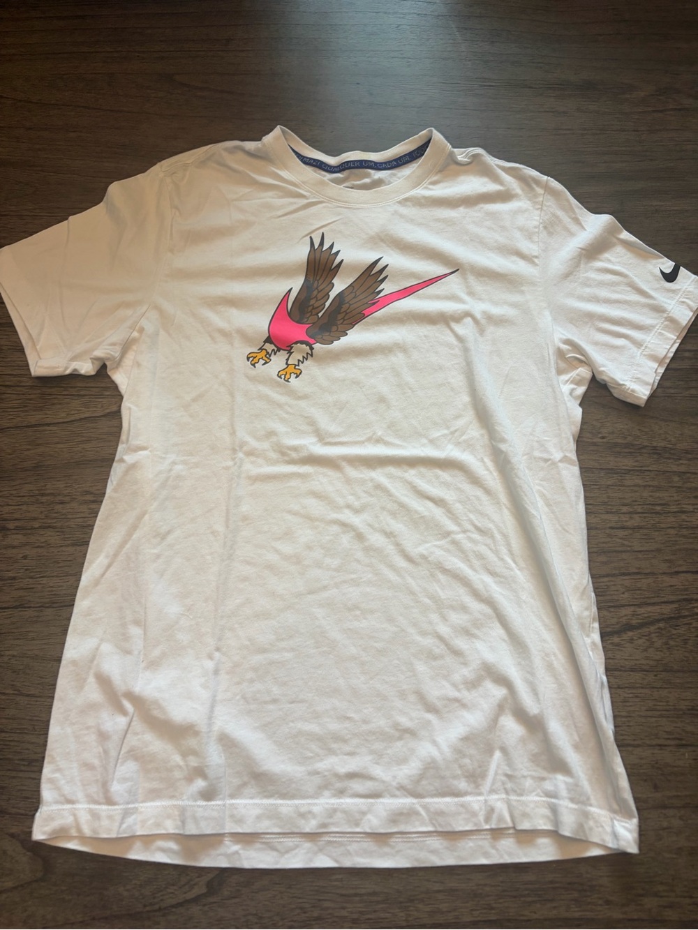 Nike White Men’s Graphic Short-Sleeve Shirt with Pink Eagle Accent